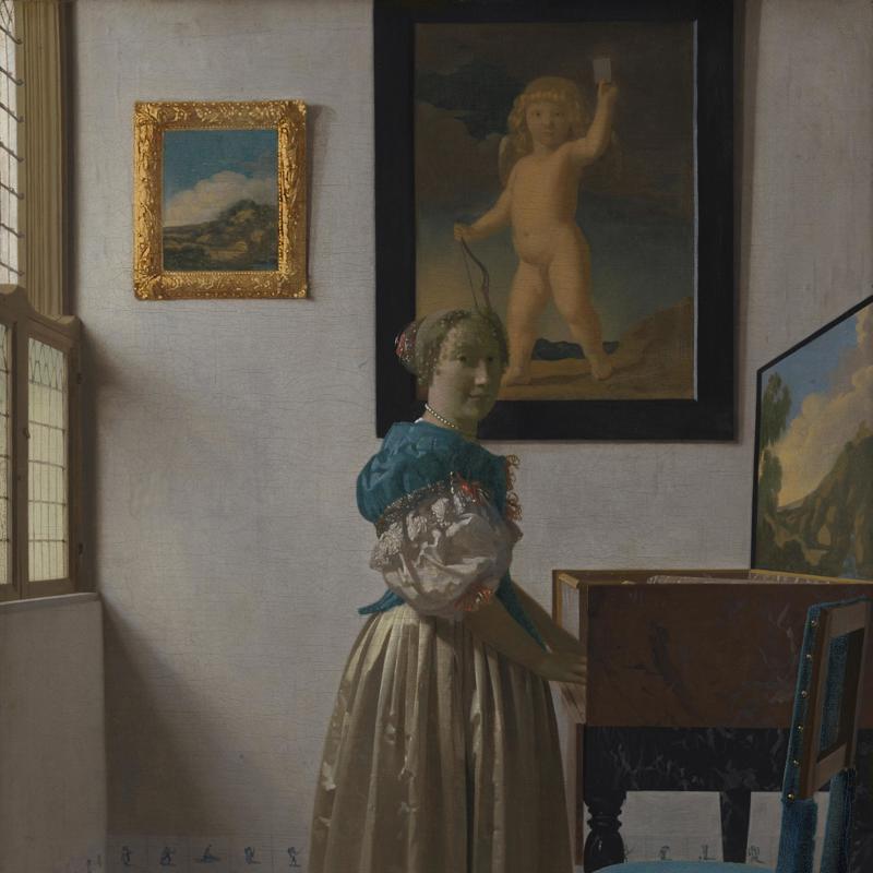 A Young Woman standing at a Virginal